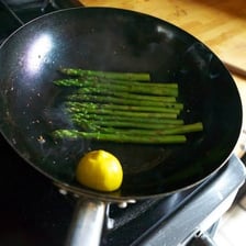 A pan of food cooking in vigorously boiling water