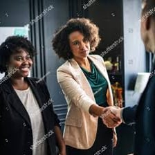 Two people shaking hands after reaching an agreement.