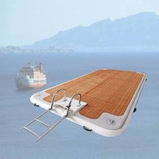 Several wooden rafts floating on a body of water