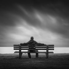 A person remaining in one place while waiting