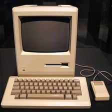 An original Apple Macintosh 128K computer.