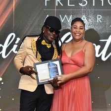 Award ceremony scene representing public acclaim and prestige