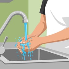 A person rinsing an object under running water