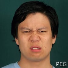 A person making a facial expression of disgust.