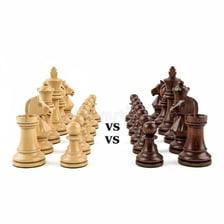 Two chess pieces positioned as opponents