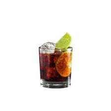 A glass containing dark rum.