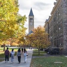 Students walking outside a university campus building