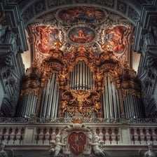 A large pipe organ with rows of pipes in a church interior