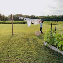 Clothes hanging outdoors to dry on a washing line.