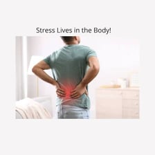 A person showing physical tension by gripping their hands.
