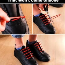 Hands tying a loose shoelace again