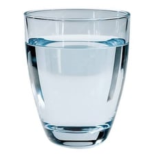 A glass containing clear, pure-looking water