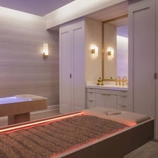 A spa treatment room prepared for massage and pedicure services