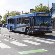 A public bus carrying passengers on a city street