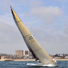 A small single-masted sailing boat on the water