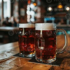 Several glasses of beer at a social gathering
