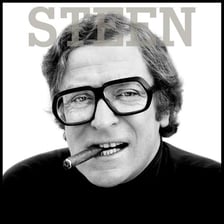 A portrait of English actor Michael Caine.