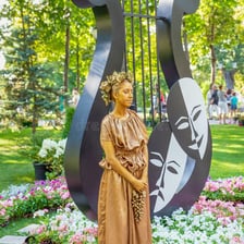 A statue standing motionless in a park