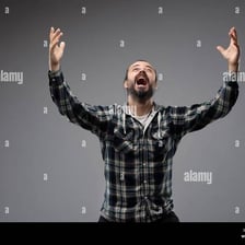 A person making an earnest appeal with an expressive gesture.