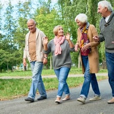 An older adult walking outdoors