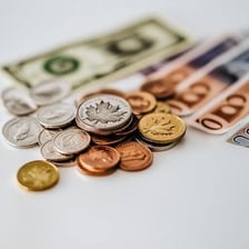 Coins and banknotes representing money