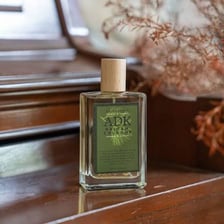 A bottle of cologne representing a fragrance or scent