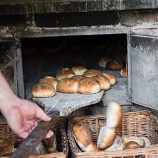 A loaf of bread being cooked in an oven