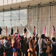 People wearing clothing associated with a current fashion trend.