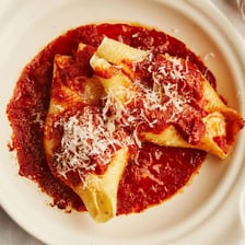 A bowl of tomato sauce served with pasta