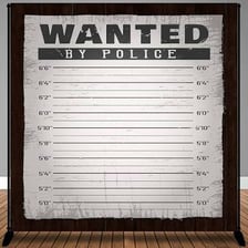 A police wanted poster displaying information about a person sought by law enforcement.