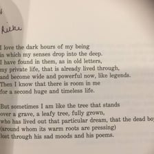 An open book displaying a poem