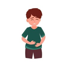 A child holding their stomach to indicate the belly