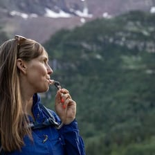A hiker drinking water after a demanding walk