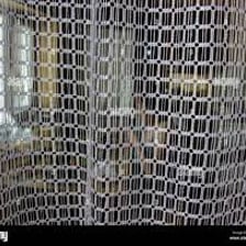 An object concealed behind a curtain and not visible