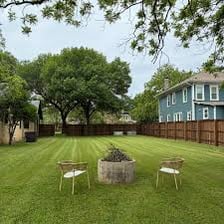 A neatly mown green lawn.