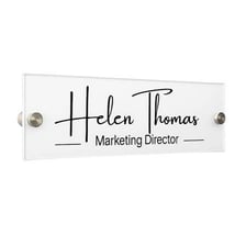 A formal nameplate displaying a person's title