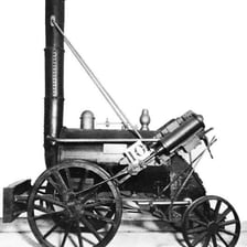 A historical reconstruction or museum display of Stephenson’s Rocket