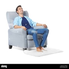 A person relaxing in an armchair