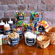 An ice-cream sundae topped with sauce and other garnishes