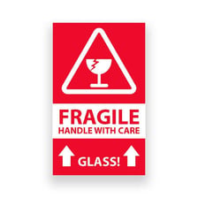 A fragile glass ornament being handled carefully.