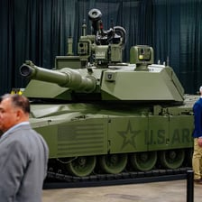A tracked armoured tank with a gun turret.