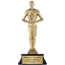 A gold trophy being presented at an award ceremony.