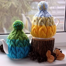 A knitted tea cosy covering a teapot