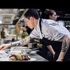 A chef preparing food in a professional kitchen