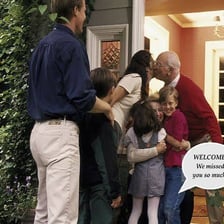 A host welcoming a guest into a home