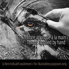 An artist working with intense concentration and enthusiasm