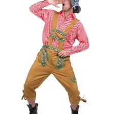 A traditional Swiss performer yodelling in an Alpine setting.