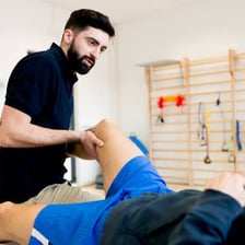A therapist providing treatment during a physical therapy session