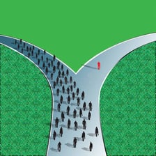 One person walking behind another along a path