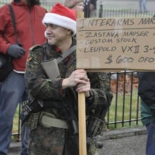 A protester standing in open opposition to authority